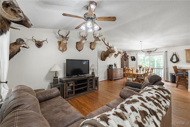 17063 Moores Mill Rd, Ruther Glen, VA 22546 - living area featuring wood finished floors, a textured ceiling, and ceiling fan