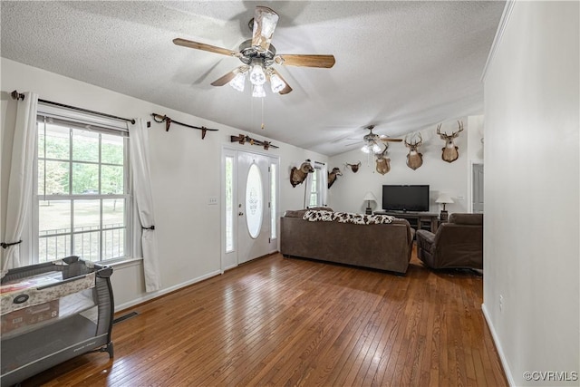 17063 Moores Mill Rd, Ruther Glen, VA 22546 - living room with hardwood / wood-style floors, ceiling fan, a textured ceiling, and baseboards