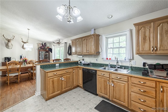 17063 Moores Mill Rd, Ruther Glen, VA 22546 - kitchen with dishwasher, a chandelier, healthy amount of natural light, dark countertops, and a textured ceiling