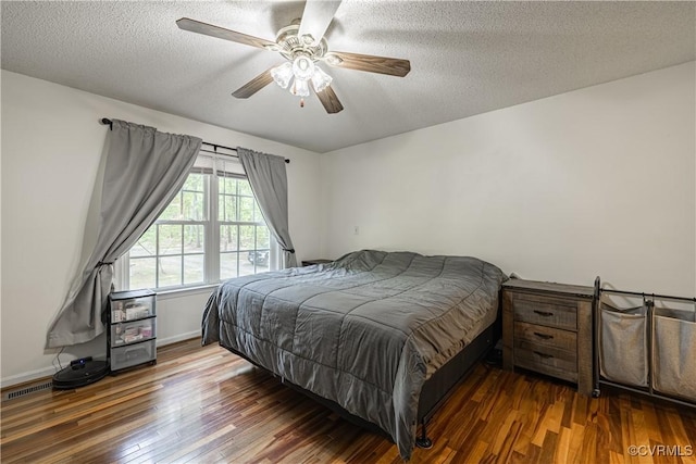 17063 Moores Mill Rd, Ruther Glen, VA 22546 - bedroom with wood finished floors, a textured ceiling, a ceiling fan, and baseboards