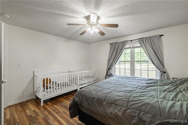 17063 Moores Mill Rd, Ruther Glen, VA 22546 - bedroom featuring wood finished floors, a textured ceiling, and a ceiling fan