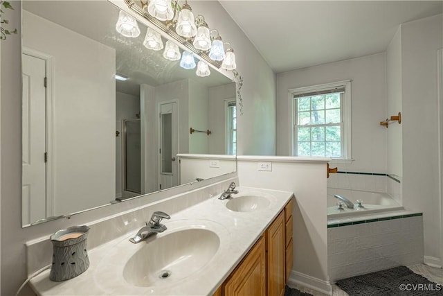 17063 Moores Mill Rd, Ruther Glen, VA 22546 - full bath with double vanity, a garden tub, a stall shower, and baseboards