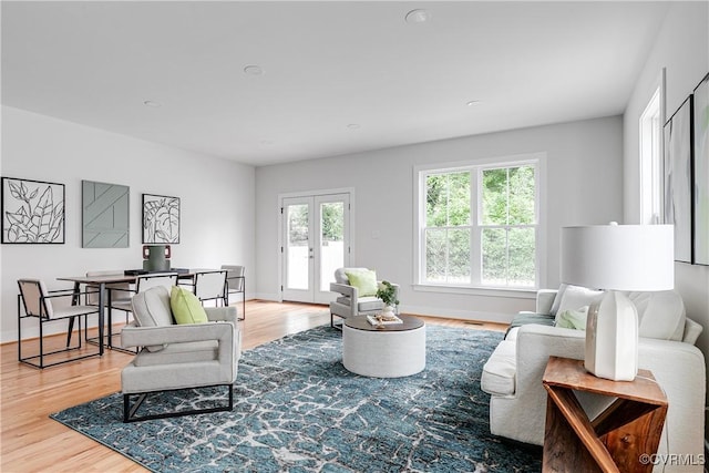 2207 Fairmount Ave, Richmond, VA 23223 - living area with wood finished floors, baseboards, french doors, and recessed lighting