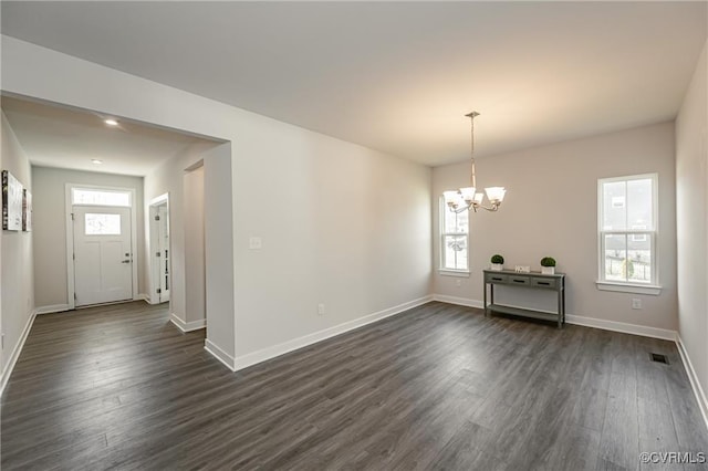 18160 Sagamore Dr, Chesterfield, VA 23120 - unfurnished dining area with a chandelier, dark wood finished floors, and baseboards