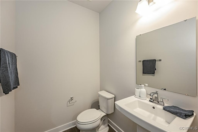 18160 Sagamore Dr, Chesterfield, VA 23120 - half bathroom with a sink, baseboards, and toilet