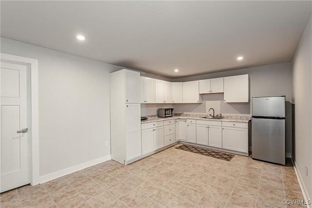 18160 Sagamore Dr, Chesterfield, VA 23120 - kitchen featuring stainless steel appliances, a sink, white cabinets, recessed lighting, and baseboards