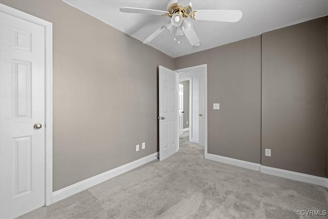 unfurnished bedroom with carpet floors, baseboards, and ceiling fan