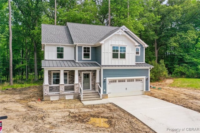 107 Wheeley Cir, Yorktown, VA 23693 - view of front of home featuring covered porch, board and batten siding, an attached garage, and concrete driveway