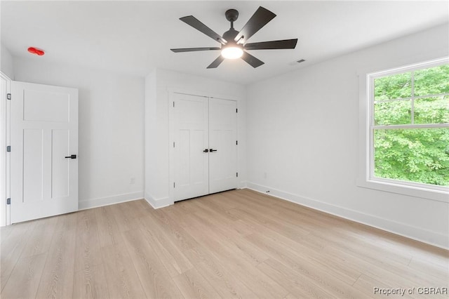 107 Wheeley Cir, Yorktown, VA 23693 - unfurnished bedroom featuring light wood-style flooring, baseboards, ceiling fan, and a closet