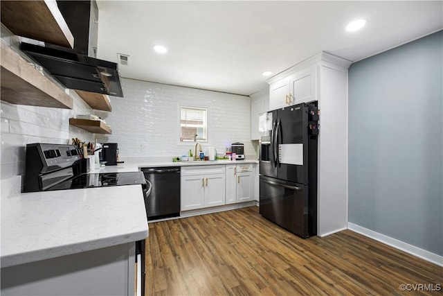 317 Cedar Ln, Hopewell, VA 23860 - kitchen with black appliances, open shelves, ventilation hood, tasteful backsplash, and recessed lighting