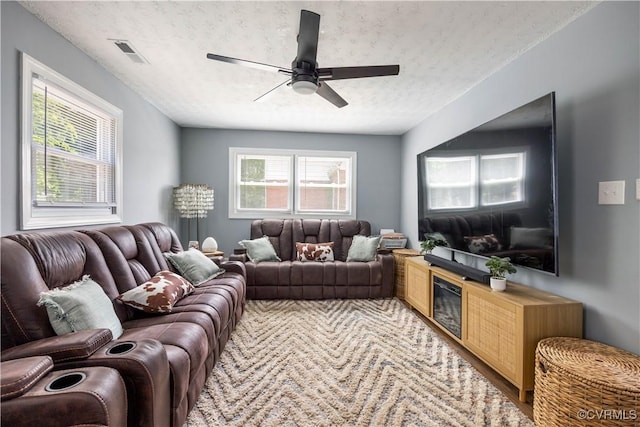 317 Cedar Ln, Hopewell, VA 23860 - living room featuring a textured ceiling and a ceiling fan