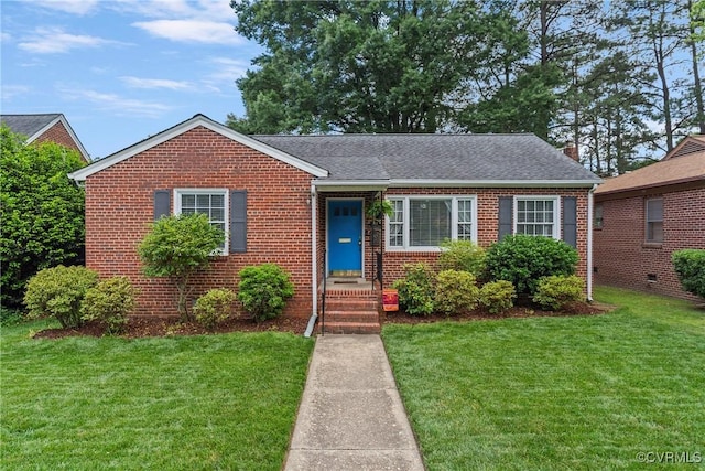 4719 W Grace St, Richmond, VA 23230 - view of front of home featuring brick siding, a front lawn, and roof with shingles
