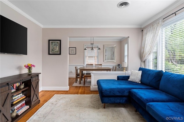 4719 W Grace St, Richmond, VA 23230 - living room with crown molding, wood finished floors, healthy amount of natural light, and baseboards
