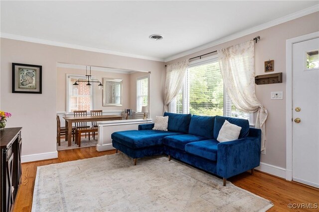 4719 W Grace St, Richmond, VA 23230 - living room featuring ornamental molding, wood finished floors, and baseboards