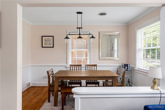 4719 W Grace St, Richmond, VA 23230 - dining room featuring ornamental molding, wood finished floors, and baseboards