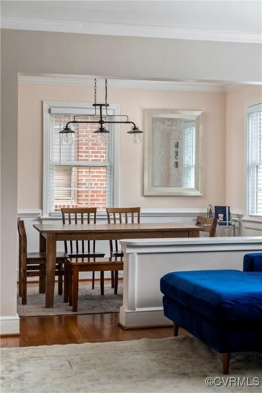 4719 W Grace St, Richmond, VA 23230 - dining area featuring ornamental molding, a chandelier, and wood finished floors