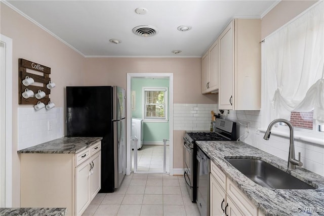 4719 W Grace St, Richmond, VA 23230 - kitchen featuring appliances with stainless steel finishes, a sink, tasteful backsplash, light tile patterned floors, and ornamental molding