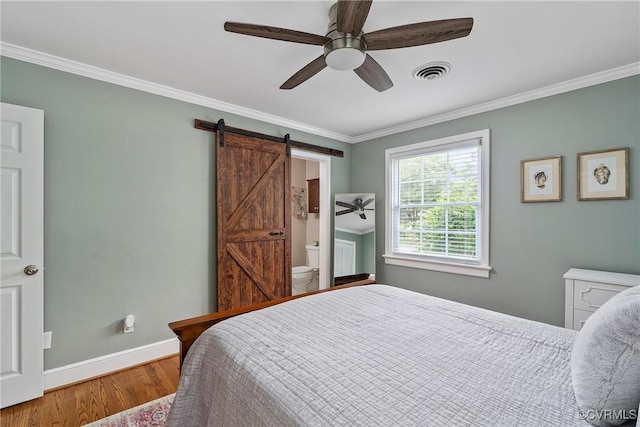 4719 W Grace St, Richmond, VA 23230 - bedroom featuring a barn door, crown molding, wood finished floors, baseboards, and a ceiling fan