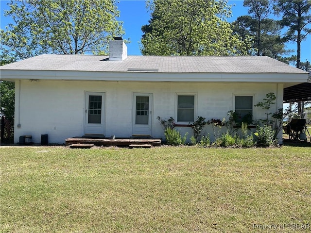 175 Riverview Ave, Water View, VA 23180 - rear view of house with a chimney, a yard, and roof with shingles