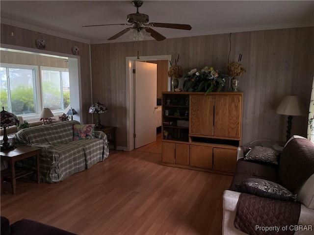 175 Riverview Ave, Water View, VA 23180 - living room featuring light wood finished floors, ceiling fan, ornamental molding, and wooden walls