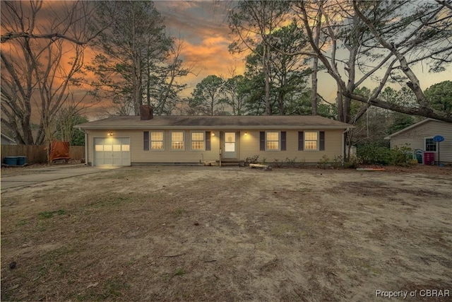 3438 Vaughan Creek Dr, Hayes, VA 23072 - single story home with an attached garage, driveway, a chimney, and entry steps