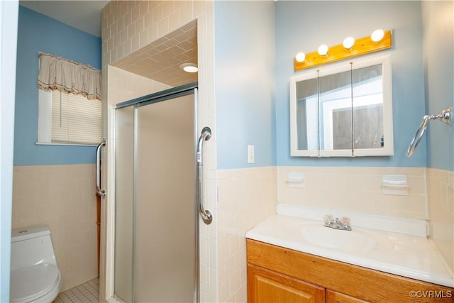 400 Allen Ave, Hopewell, VA 23860 - full bath with tile walls, a stall shower, toilet, vanity, and a wainscoted wall