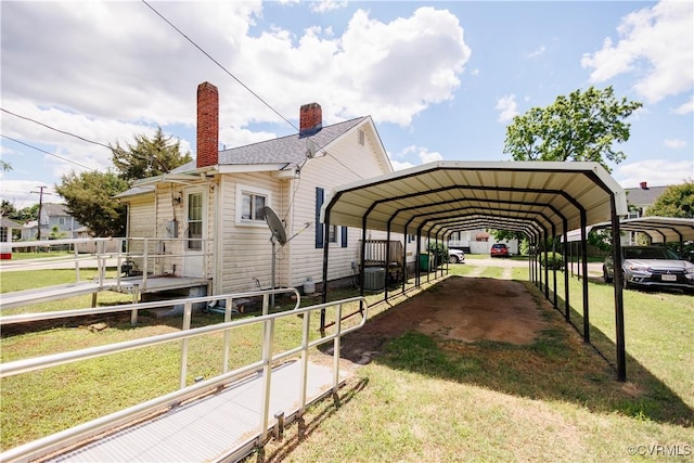 400 Allen Ave, Hopewell, VA 23860 - view of home's exterior featuring a detached carport, a chimney, central AC unit, and driveway