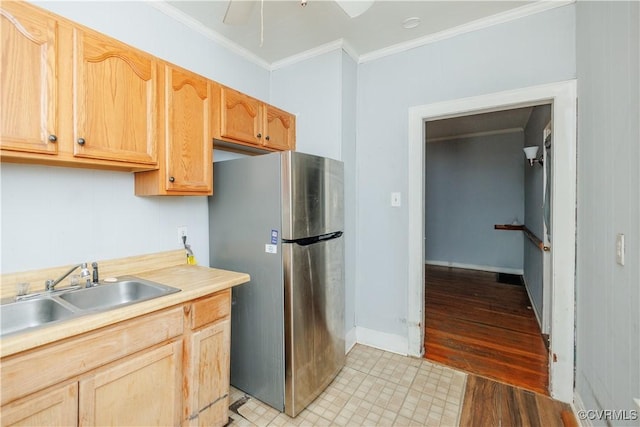 400 Allen Ave, Hopewell, VA 23860 - kitchen featuring freestanding refrigerator, a sink, ornamental molding, light countertops, and light brown cabinetry