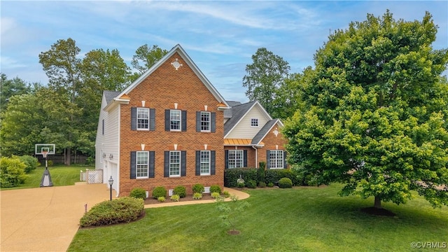 14109 Rigney Dr, Midlothian, VA 23113 - view of front of house featuring brick siding, driveway, a front lawn, and a garage