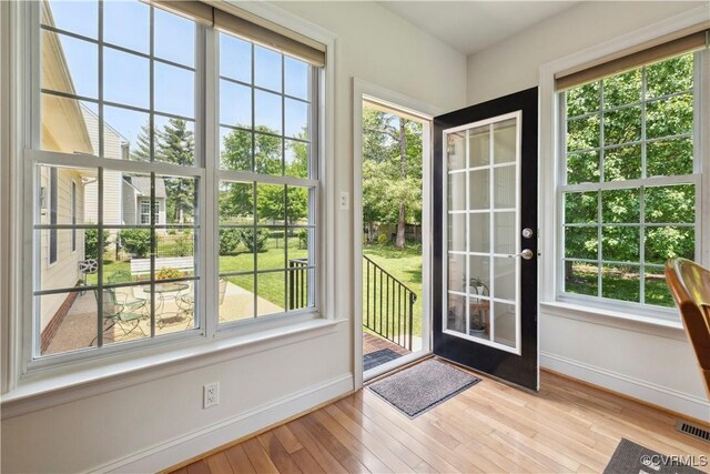 14109 Rigney Dr, Midlothian, VA 23113 - doorway featuring baseboards, hardwood / wood-style floors, and healthy amount of natural light
