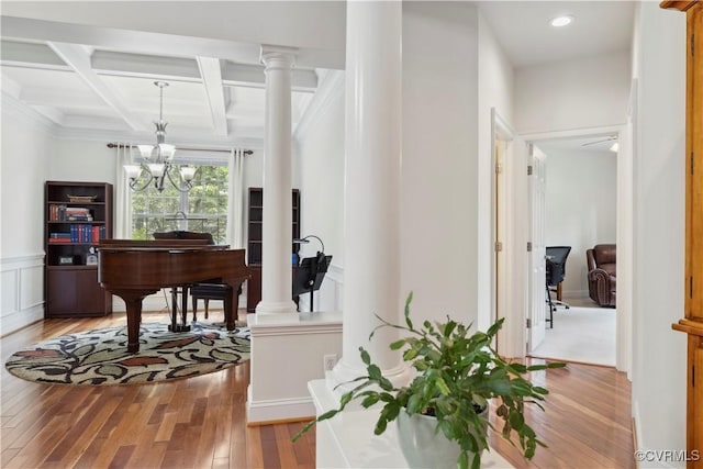 14109 Rigney Dr, Midlothian, VA 23113 - hallway with light wood-style floors, beam ceiling, decorative columns, coffered ceiling, and a chandelier