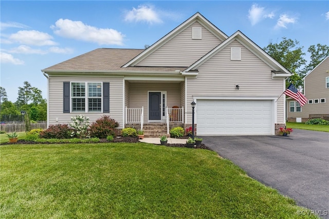 13524 Thomaswoods Ln, Ashland, VA 23005 - view of front facade featuring driveway, a front lawn, a garage, and covered porch