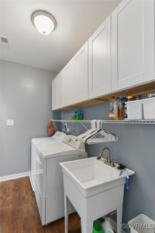 13524 Thomaswoods Ln, Ashland, VA 23005 - washroom featuring washer and clothes dryer, cabinet space, dark wood finished floors, and baseboards