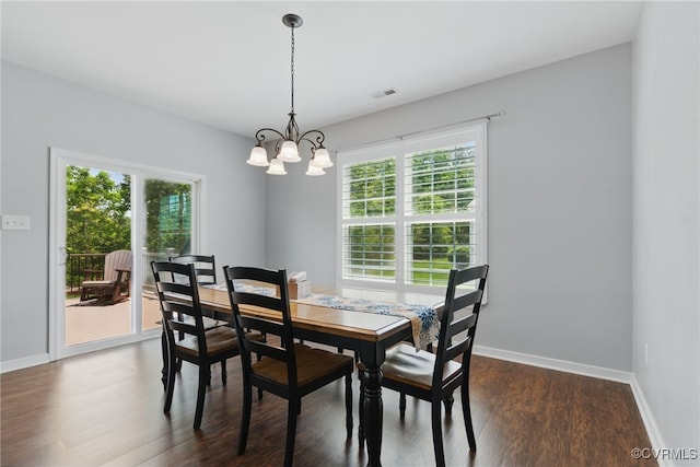 13524 Thomaswoods Ln, Ashland, VA 23005 - dining area featuring healthy amount of natural light, a chandelier, dark wood-type flooring, and baseboards