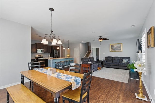 13524 Thomaswoods Ln, Ashland, VA 23005 - dining area with dark wood-type flooring, baseboards, a ceiling fan, and stairway