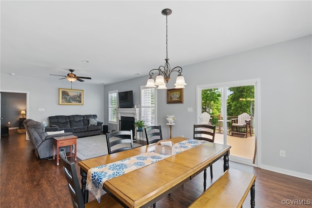 13524 Thomaswoods Ln, Ashland, VA 23005 - dining room featuring wood finished floors, a fireplace, baseboards, a ceiling fan, and a chandelier