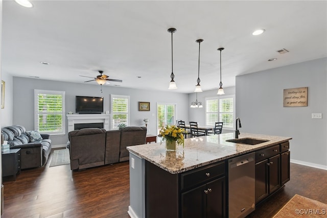 13524 Thomaswoods Ln, Ashland, VA 23005 - kitchen with a sink, stainless steel dishwasher, dark wood-style floors, ceiling fan, and light stone countertops