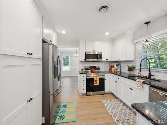 2004 Deer Meadow Ct, Chesterfield, VA 23112 - kitchen featuring stainless steel appliances, a sink, light wood-style flooring, white cabinetry, and recessed lighting