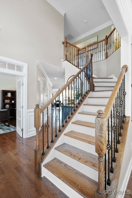16300 Midnight Xing, Chesterfield, VA 23120 - stairway with a towering ceiling, wood finished floors, ornamental molding, french doors, and wainscoting