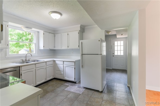 10002 Laurel Lakes Dr, Glen Allen, VA 23060 - kitchen featuring freestanding refrigerator, a sink, a textured ceiling, white cabinetry, and light countertops