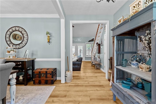 6304 Belroi Rd, Abingdon, VA 23061 - foyer entrance featuring wood finished floors, a textured ceiling, baseboards, french doors, and crown molding