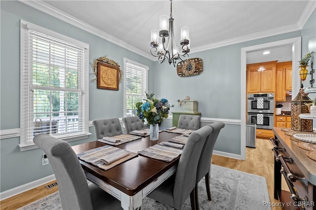 6304 Belroi Rd, Abingdon, VA 23061 - dining space with a chandelier, crown molding, light wood-type flooring, and baseboards
