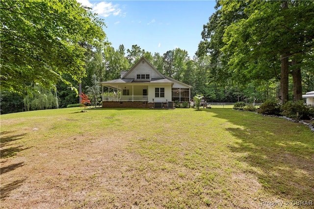 6304 Belroi Rd, Abingdon, VA 23061 - rear view of house with a lawn and a sunroom