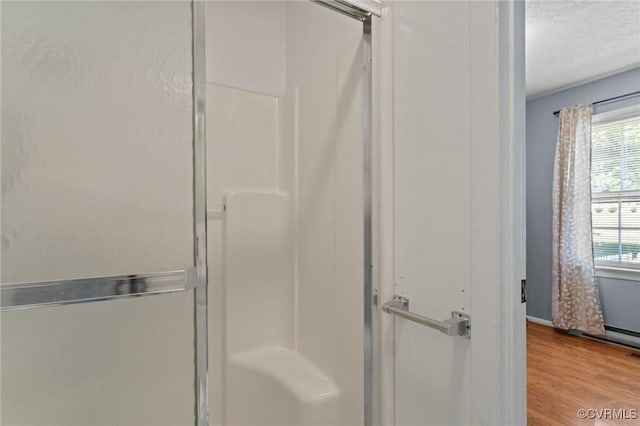 2721 Fawnwick Dr, Henrico, VA 23231 - bathroom featuring a shower stall, wood finished floors, a textured ceiling, and baseboards