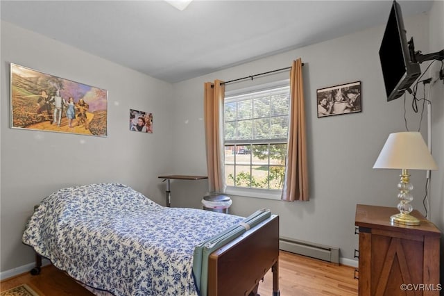 2721 Fawnwick Dr, Henrico, VA 23231 - bedroom with a baseboard radiator, light wood-style floors, and baseboards