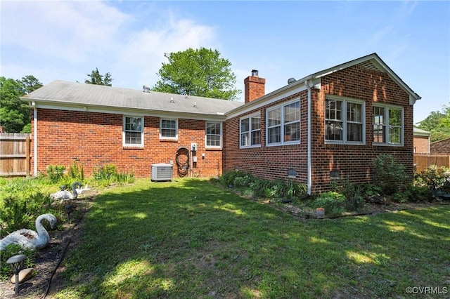 2721 Fawnwick Dr, Henrico, VA 23231 - back of house with central AC, brick siding, and a chimney
