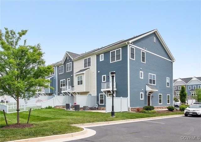 5200 Gower Pl, Glen Allen, VA 23059 - view of building exterior with cooling unit, a residential view, and uncovered parking