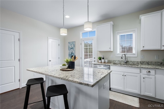 5200 Gower Pl, Glen Allen, VA 23059 - kitchen with a sink, dark wood-type flooring, a kitchen bar, white cabinetry, and a kitchen island
