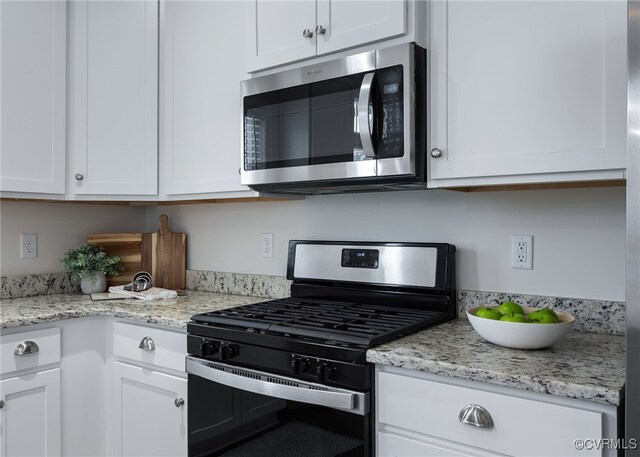 5200 Gower Pl, Glen Allen, VA 23059 - kitchen with stainless steel appliances, white cabinets, and light stone counters