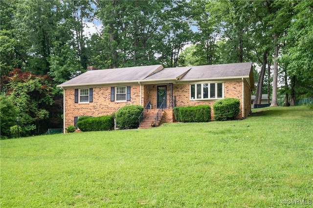 7708 Stonetree Dr, North Chesterfield, VA 23235 - single story home featuring a front lawn, brick siding, and a chimney